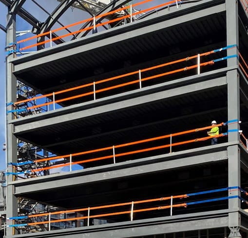 StrapRail installed on a steel building to provide fall protection for workers.